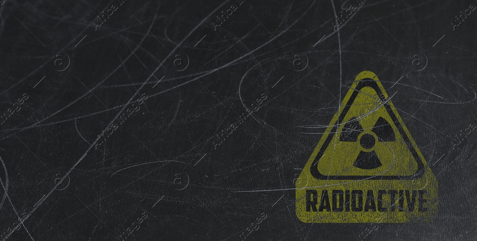 Image of Yellow radioactive sign on scratched black background, banner design. Radiological pollution