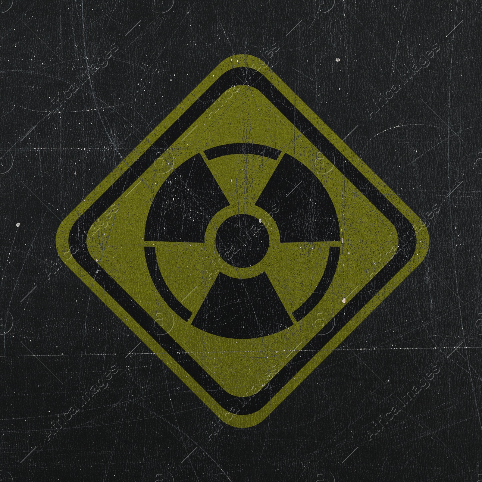 Image of Yellow radioactive sign on scratched black background. Radiological pollution