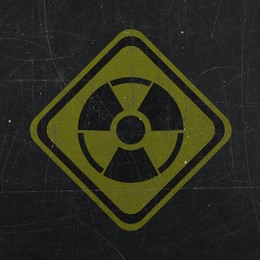 Image of Yellow radioactive sign on scratched black background. Radiological pollution