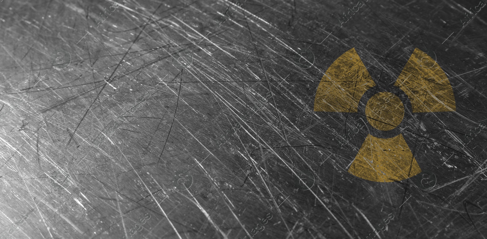 Image of Orange radioactive sign on scratched metal background, banner design. Radiological pollution