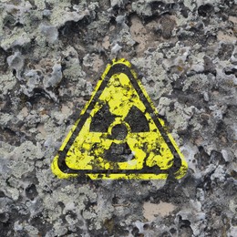 Image of Yellow radioactive sign on textured background. Radiological pollution
