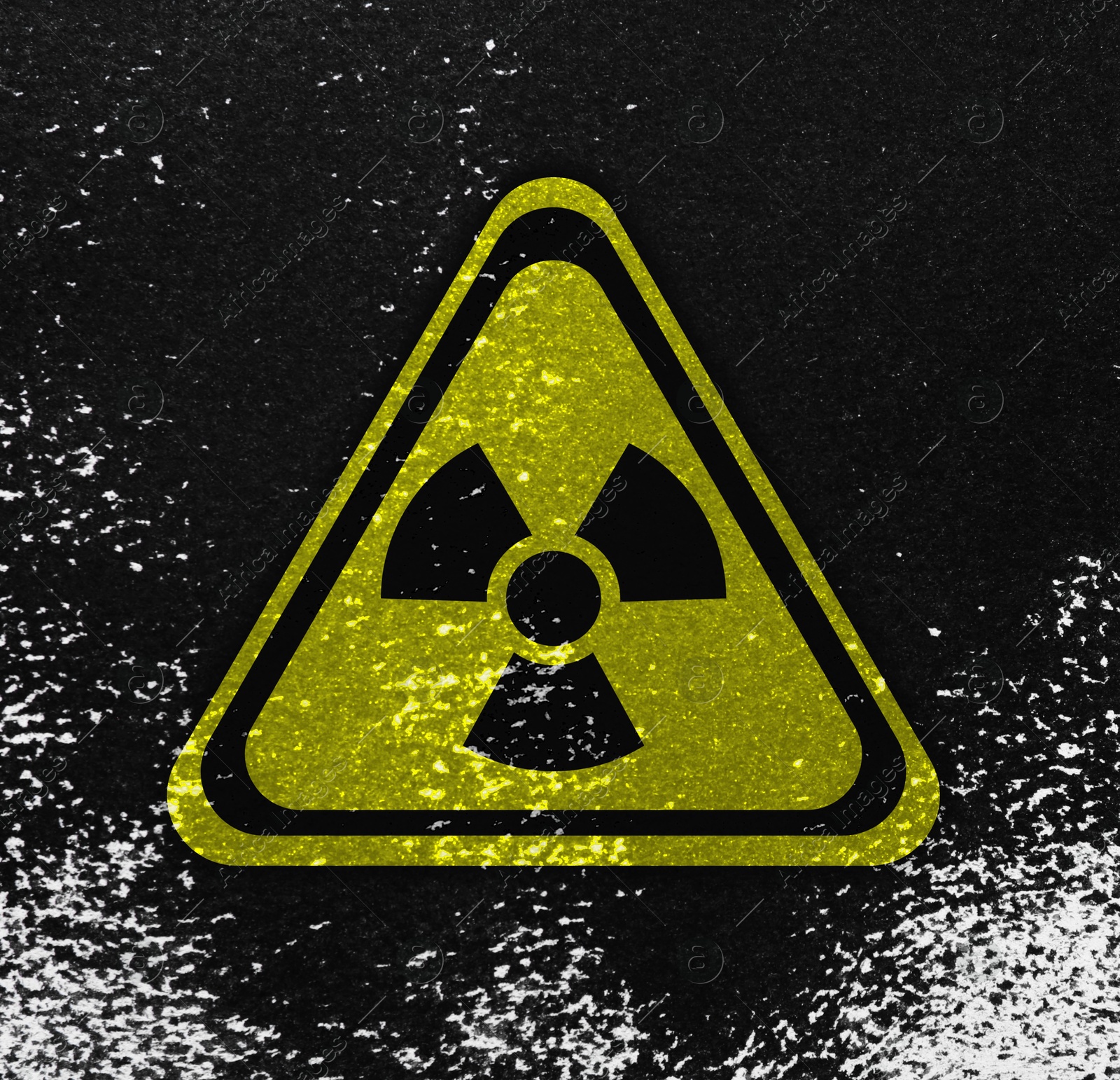 Image of Yellow radioactive sign on black textured background. Radiological pollution