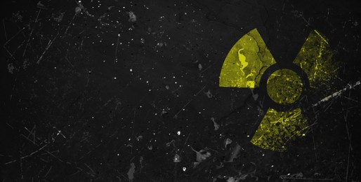 Image of Yellow radioactive sign on black textured background, banner design. Radiological pollution