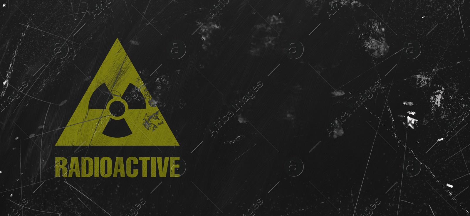 Yellow radioactive sign on black textured background, banner design. Radiological pollution Image of Yellow radioactive sign on black textured background, banner design. Radiological pollution