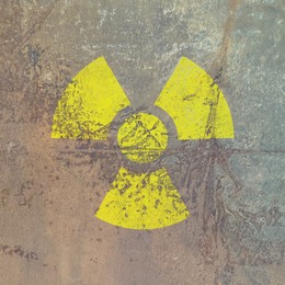 Image of Yellow radioactive sign on textured background. Radiological pollution