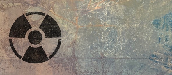 Image of Black radioactive sign on textured background, banner design. Radiological pollution