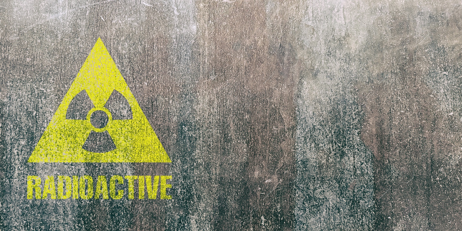 Image of Yellow radioactive sign on textured background, banner design. Radiological pollution