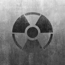 Image of Black radioactive sign on textured background. Radiological pollution