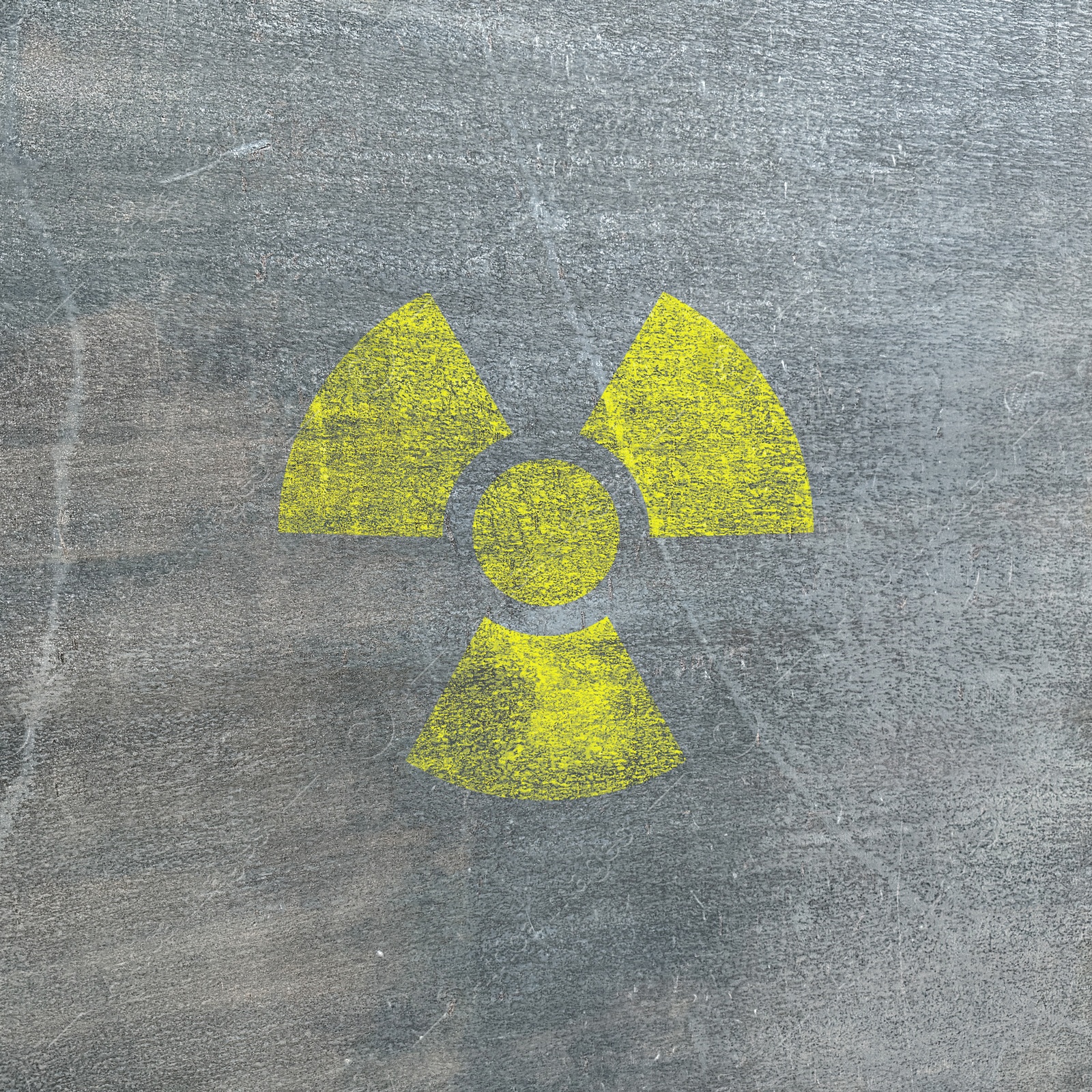 Image of Yellow radioactive sign on textured background. Radiological pollution