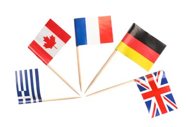 Image of Small paper flags of United Kingdom, Germany, France, Canada and Greece isolated on white, set