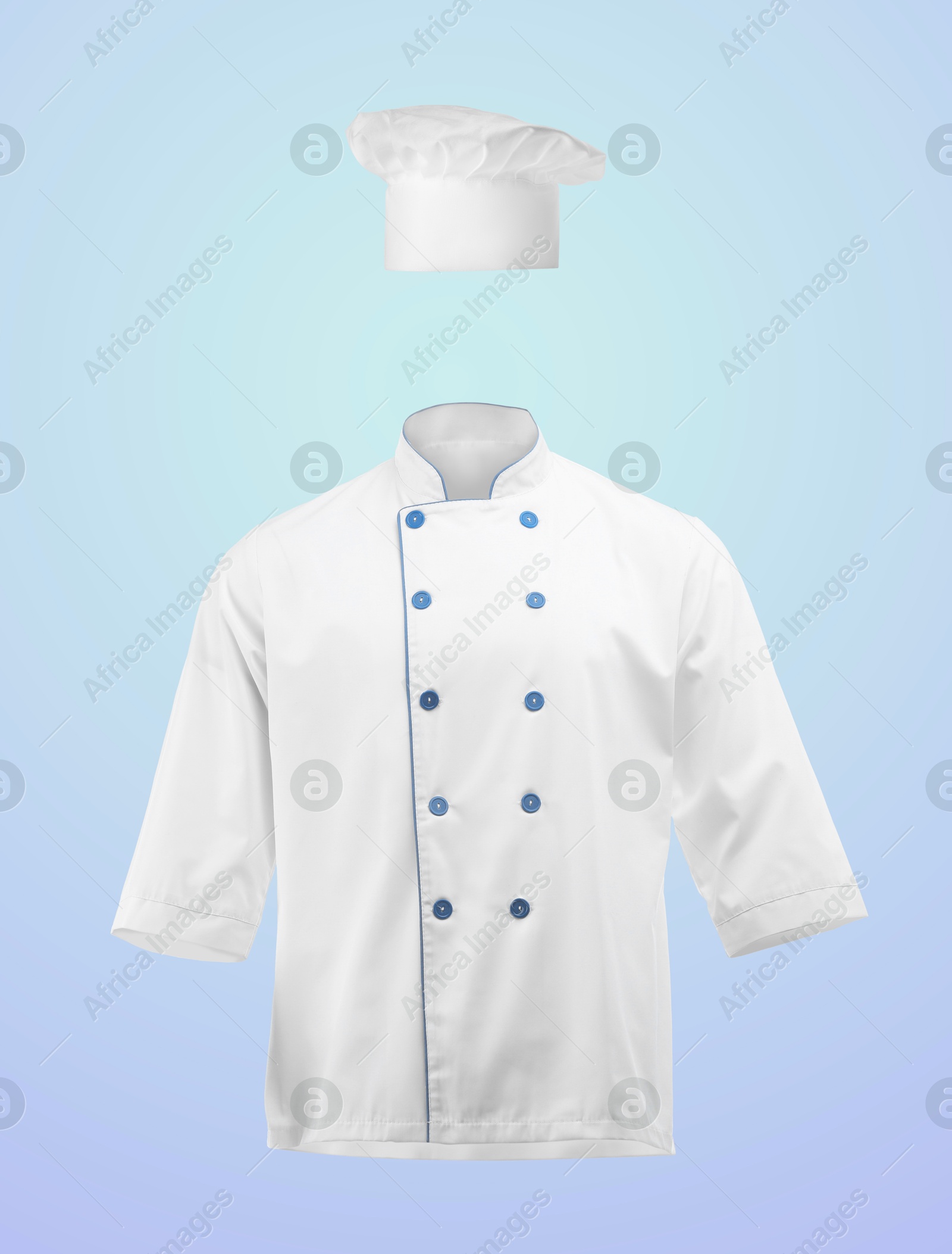 Chef's uniform in air against light blue background. Toque and jacket Image of Chef's uniform in air against light blue background. Toque and jacket