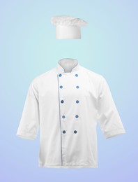 Image of Chef's uniform in air against light blue background. Toque and jacket