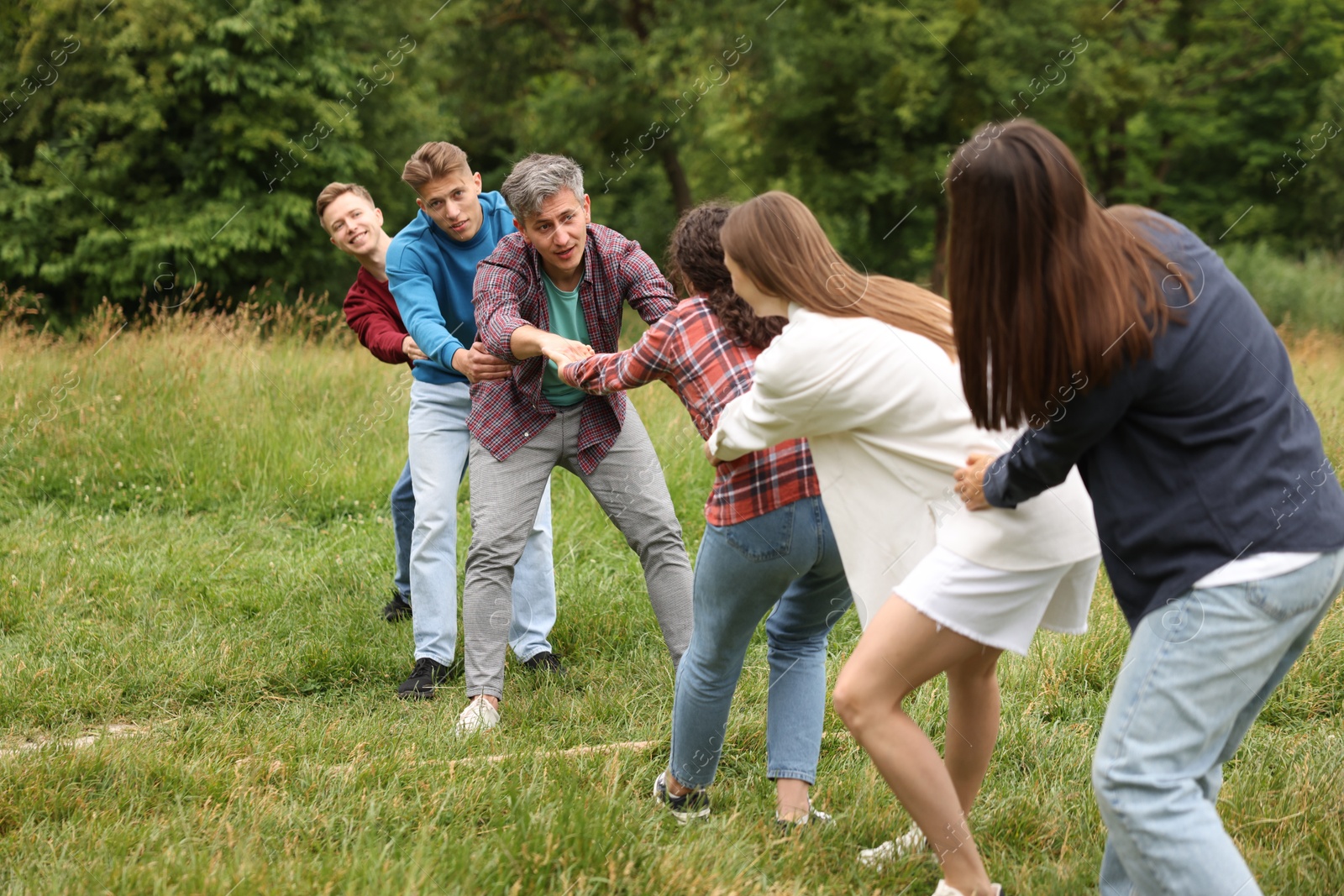 Team building. Group of happy people holding hands outdoors Photo of Team building. Group of happy people holding hands outdoors