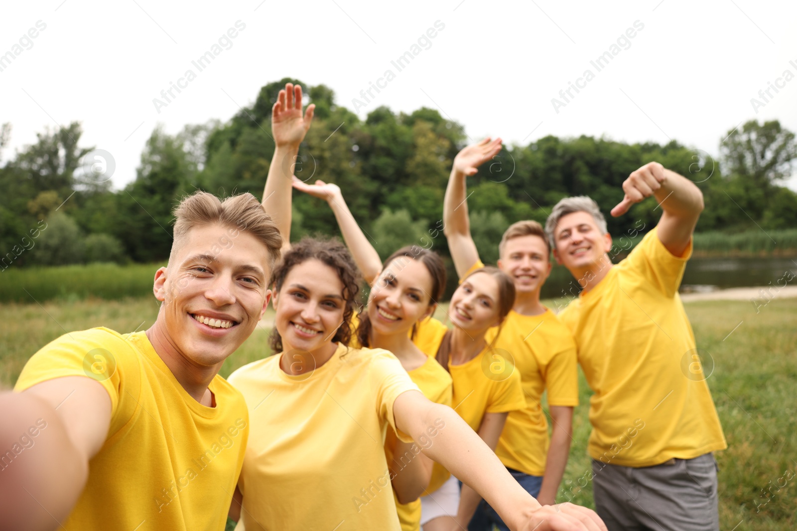 Team building. Group of happy people taking selfie outdoors Photo of Team building. Group of happy people taking selfie outdoors