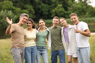 Photo of Team building. Group of happy people together outdoors