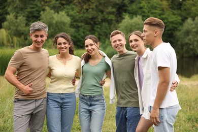 Photo of Team building. Group of happy people together outdoors