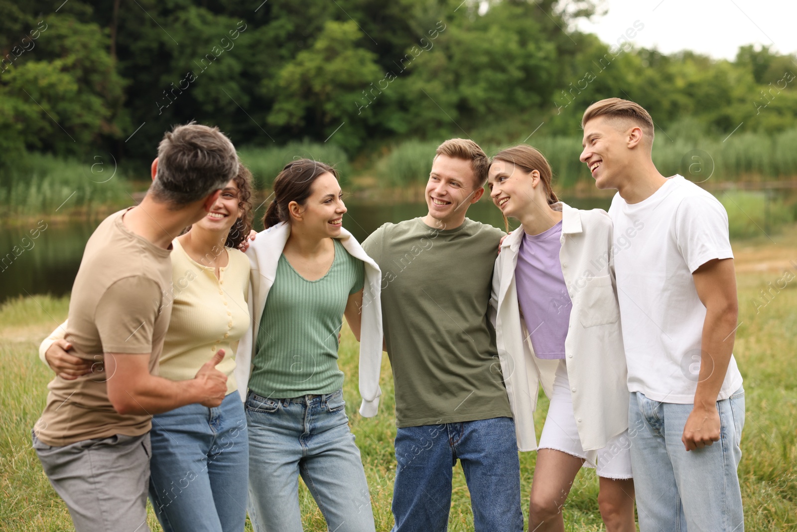 Photo of Team building. Group of happy people together outdoors