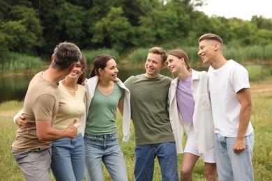 Photo of Team building. Group of happy people together outdoors