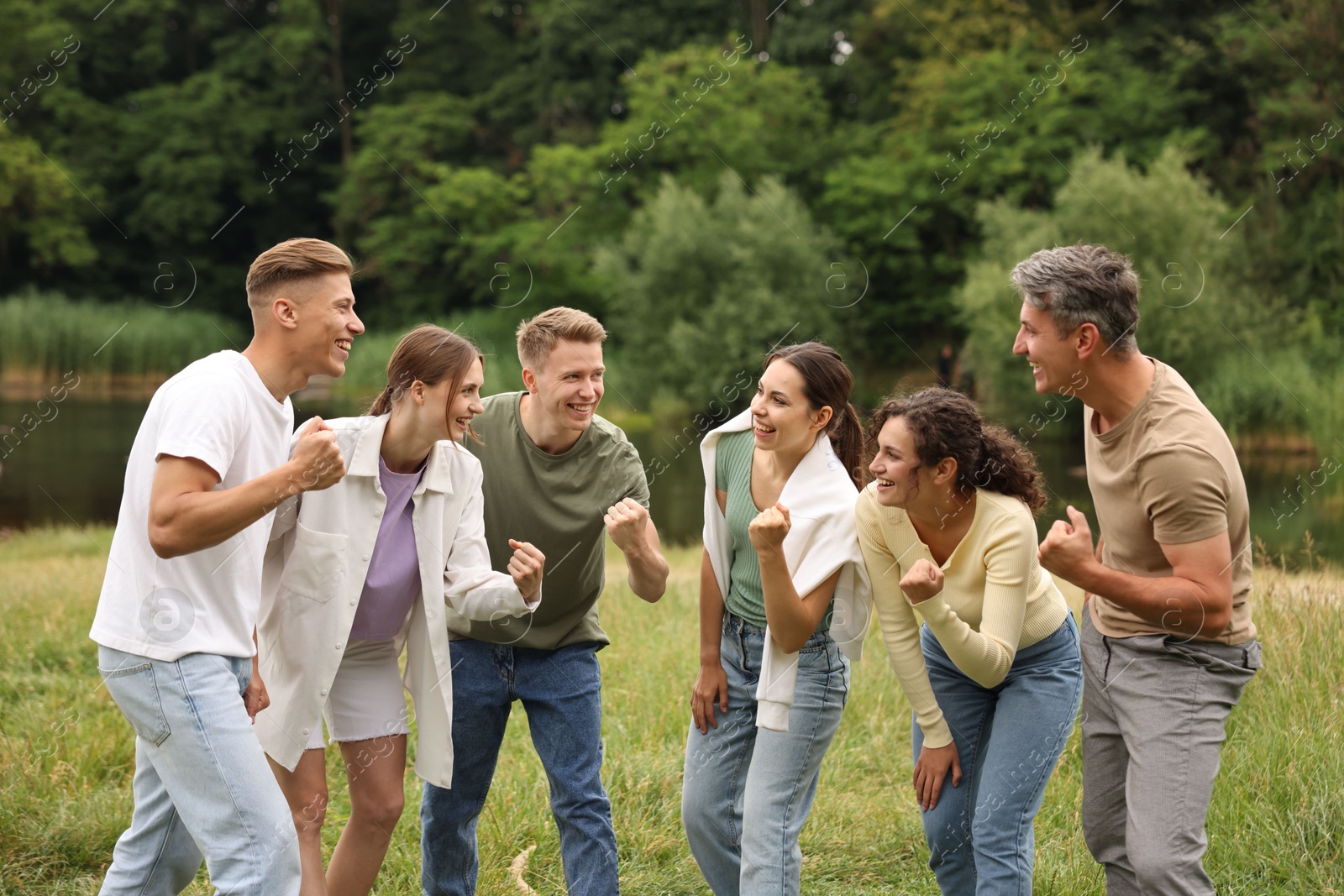 Team building. Group of happy people together outdoors Photo of Team building. Group of happy people together outdoors