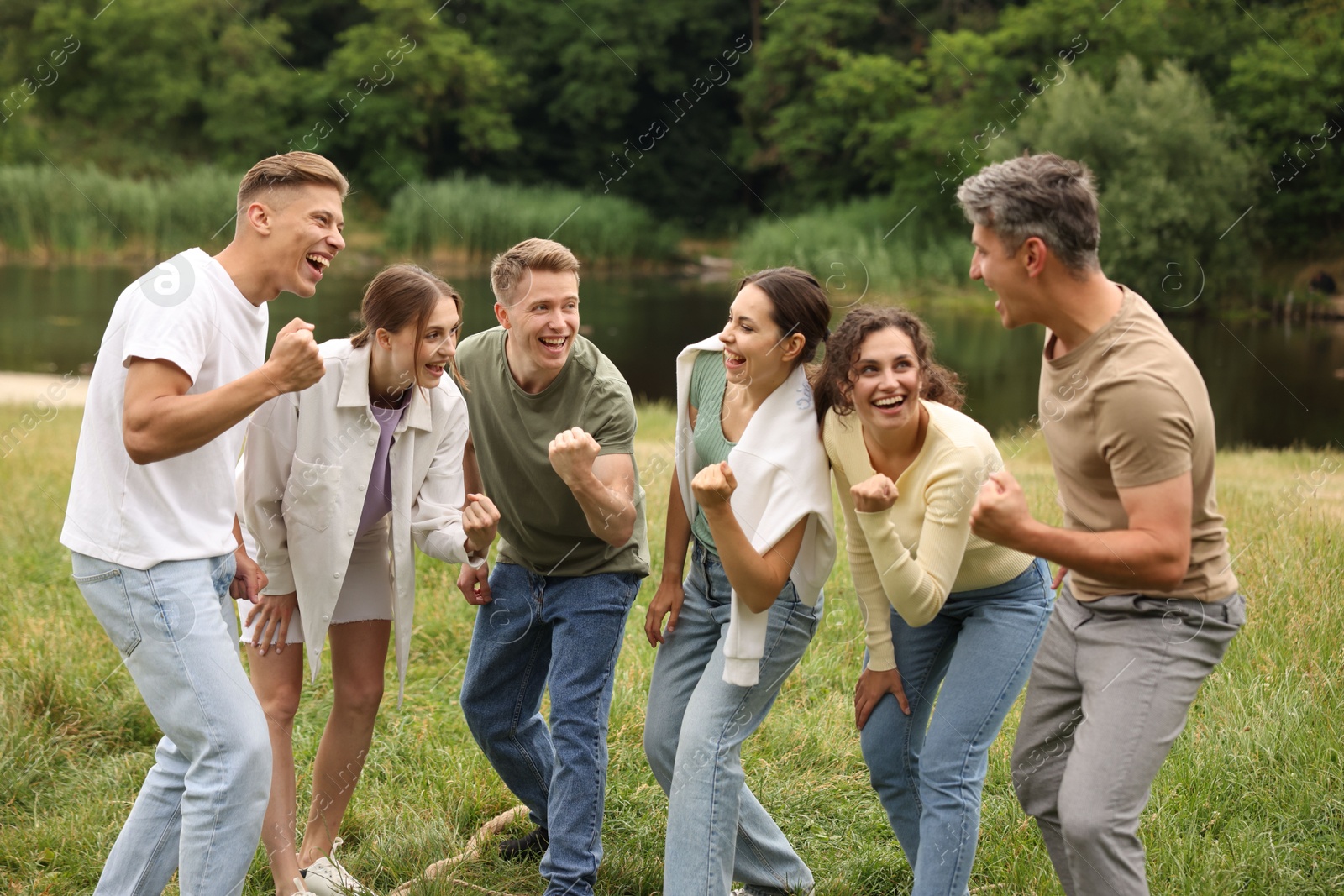 Team building. Group of happy people together outdoors Photo of Team building. Group of happy people together outdoors