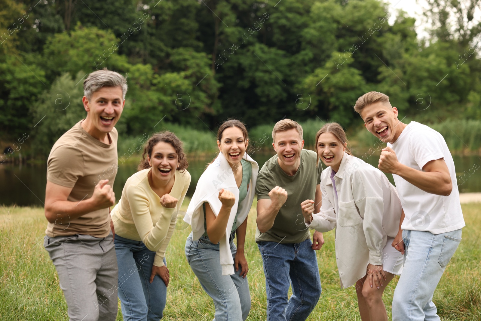 Team building. Group of happy people together outdoors Photo of Team building. Group of happy people together outdoors