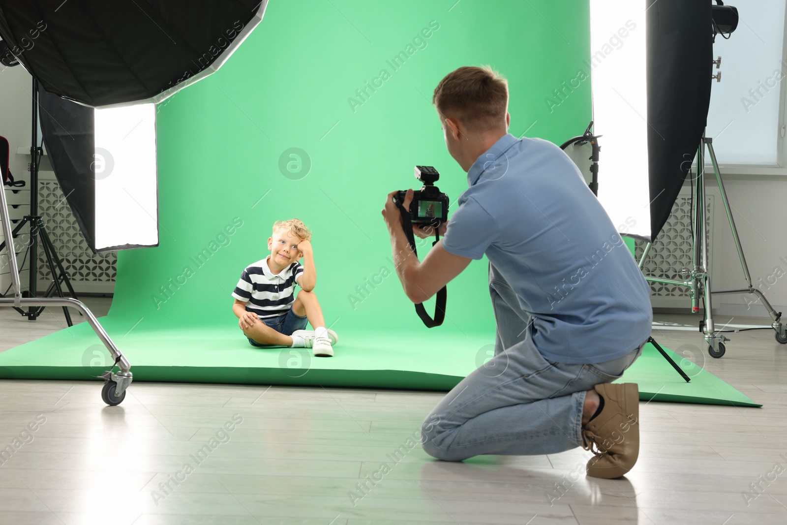 Photographer working with model in professional photo studio Photo of Photographer working with model in professional photo studio