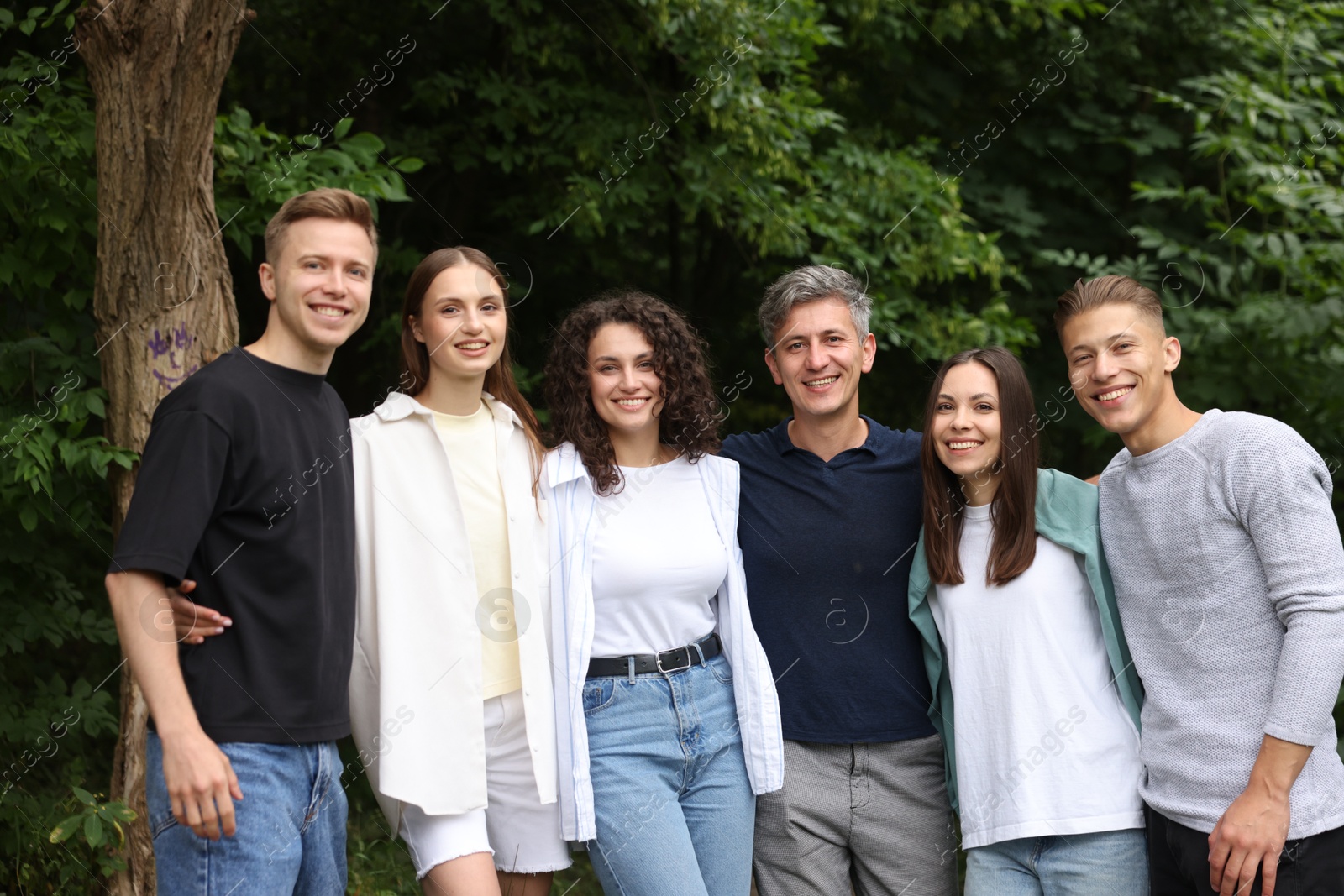 Team building. Group of happy people together outdoors Photo of Team building. Group of happy people together outdoors