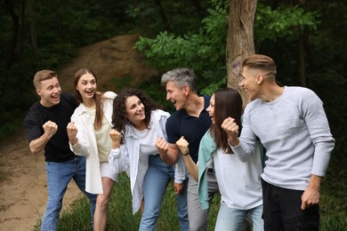 Photo of Team building. Group of happy people together outdoors