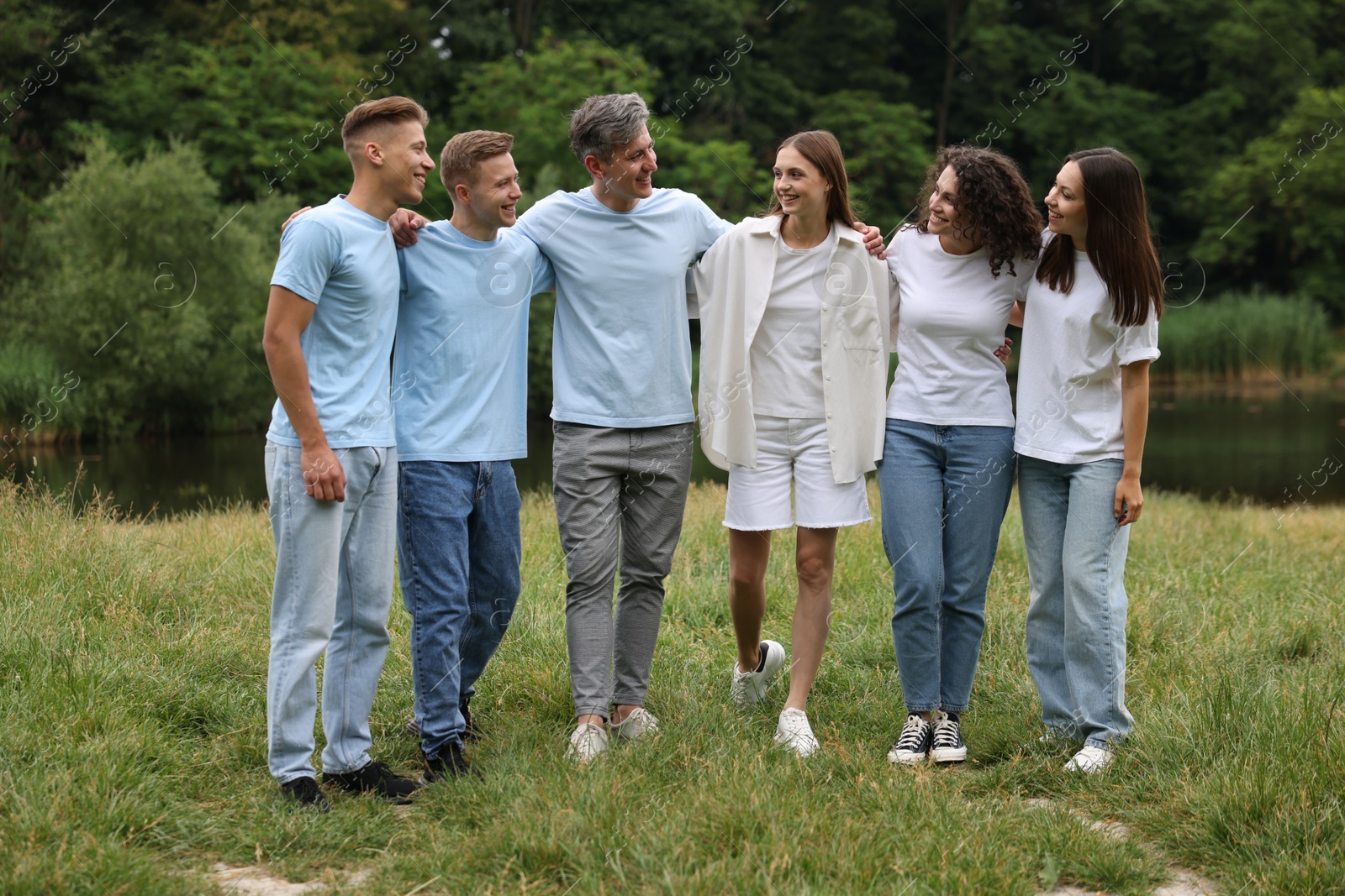 Team building. Group of happy people together outdoors Photo of Team building. Group of happy people together outdoors