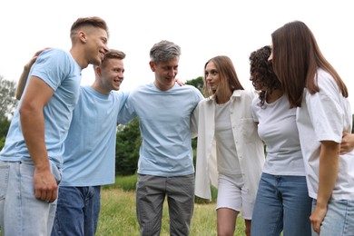 Photo of Team building. Group of happy people together outdoors