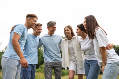 Photo of Team building. Group of happy people together outdoors