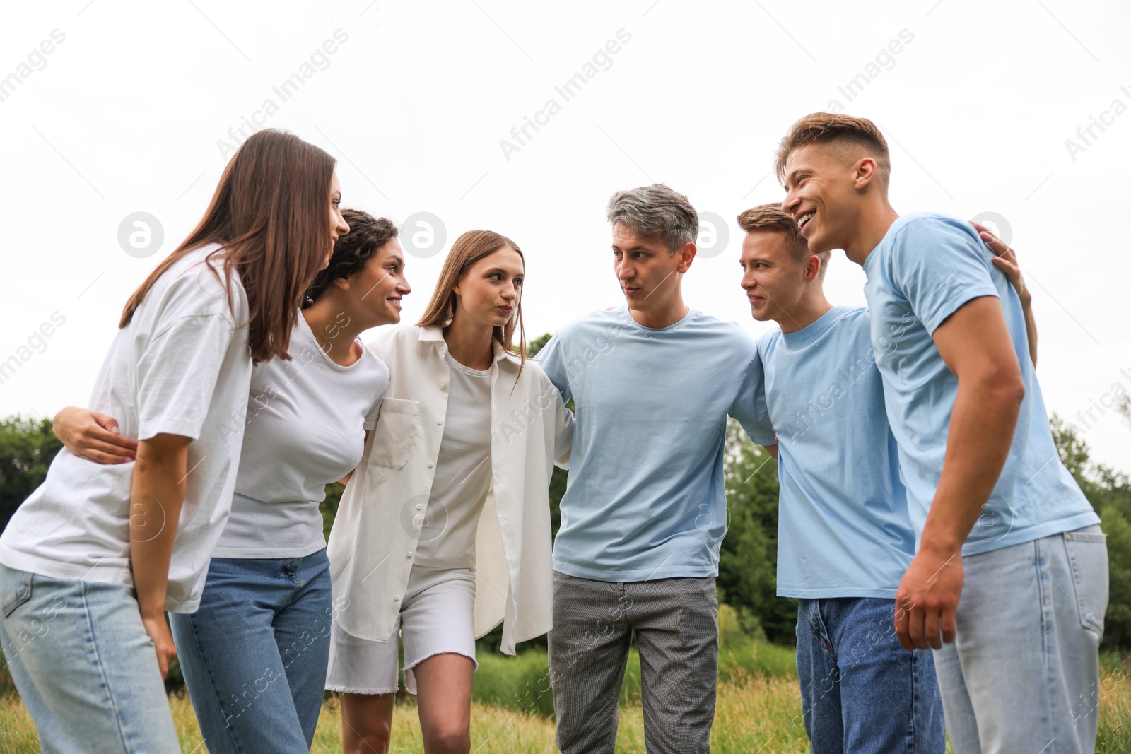 Team building. Group of happy people together outdoors Photo of Team building. Group of happy people together outdoors