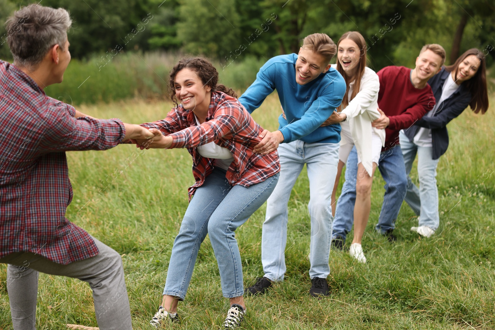 Team building. Group of happy people holding hands outdoors Photo of Team building. Group of happy people holding hands outdoors