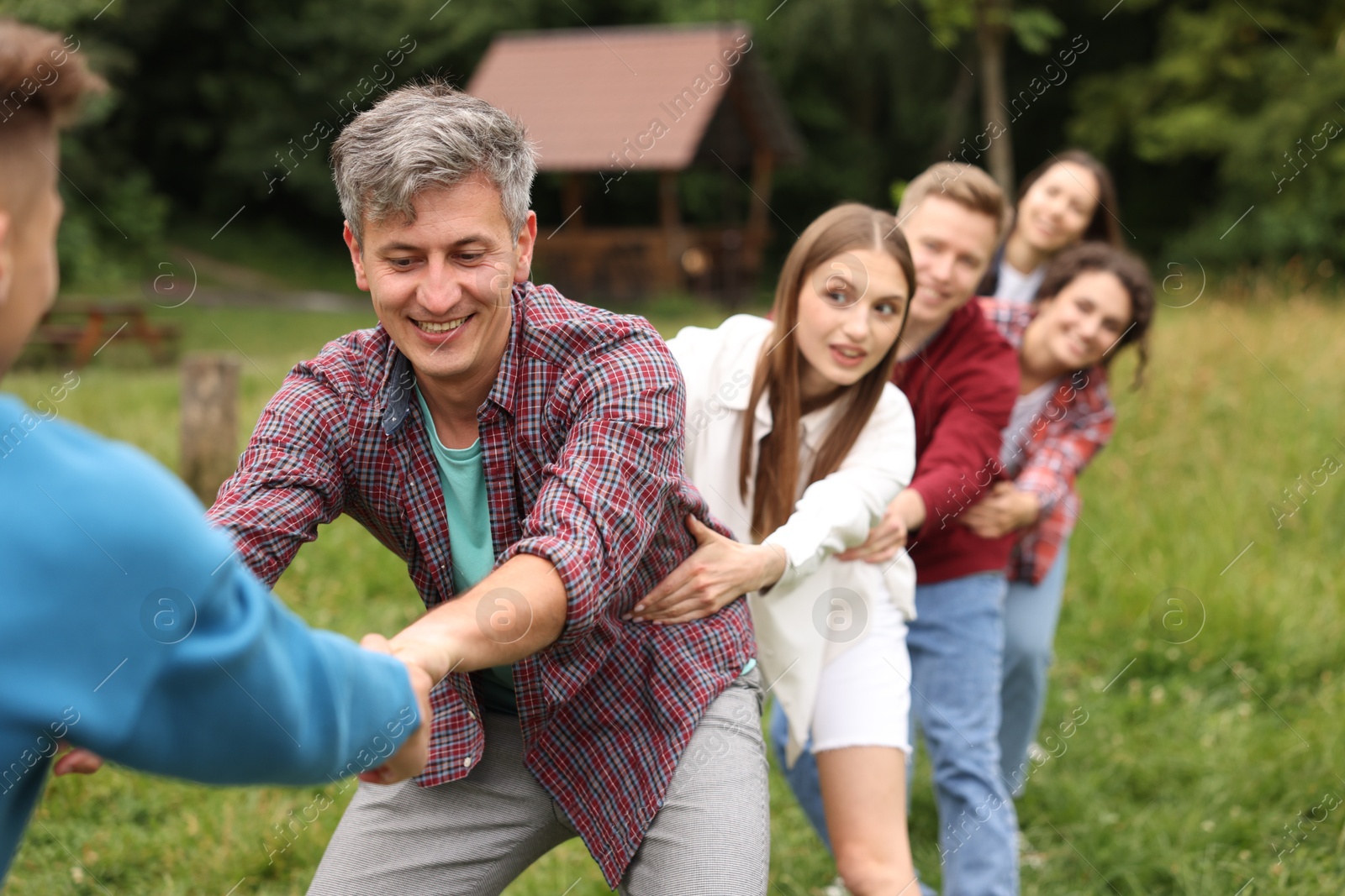 Team building. Group of happy people holding hands outdoors Photo of Team building. Group of happy people holding hands outdoors