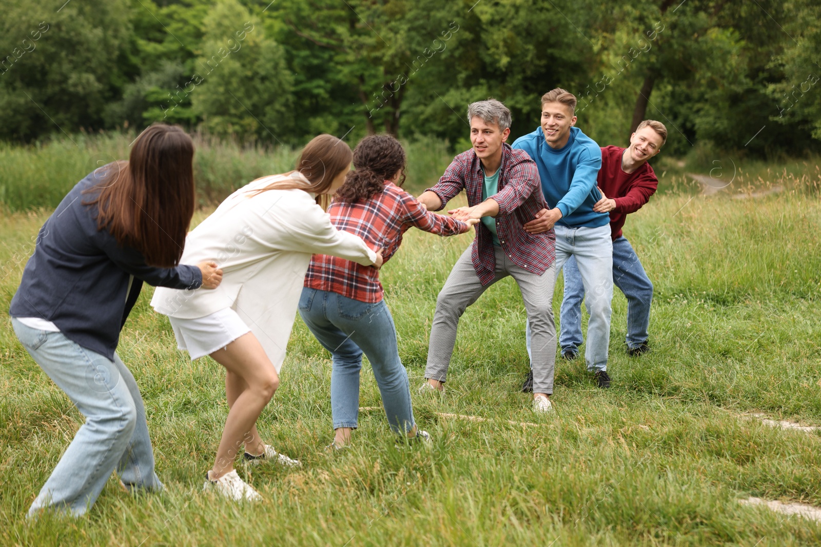 Team building. Group of happy people holding hands outdoors Photo of Team building. Group of happy people holding hands outdoors