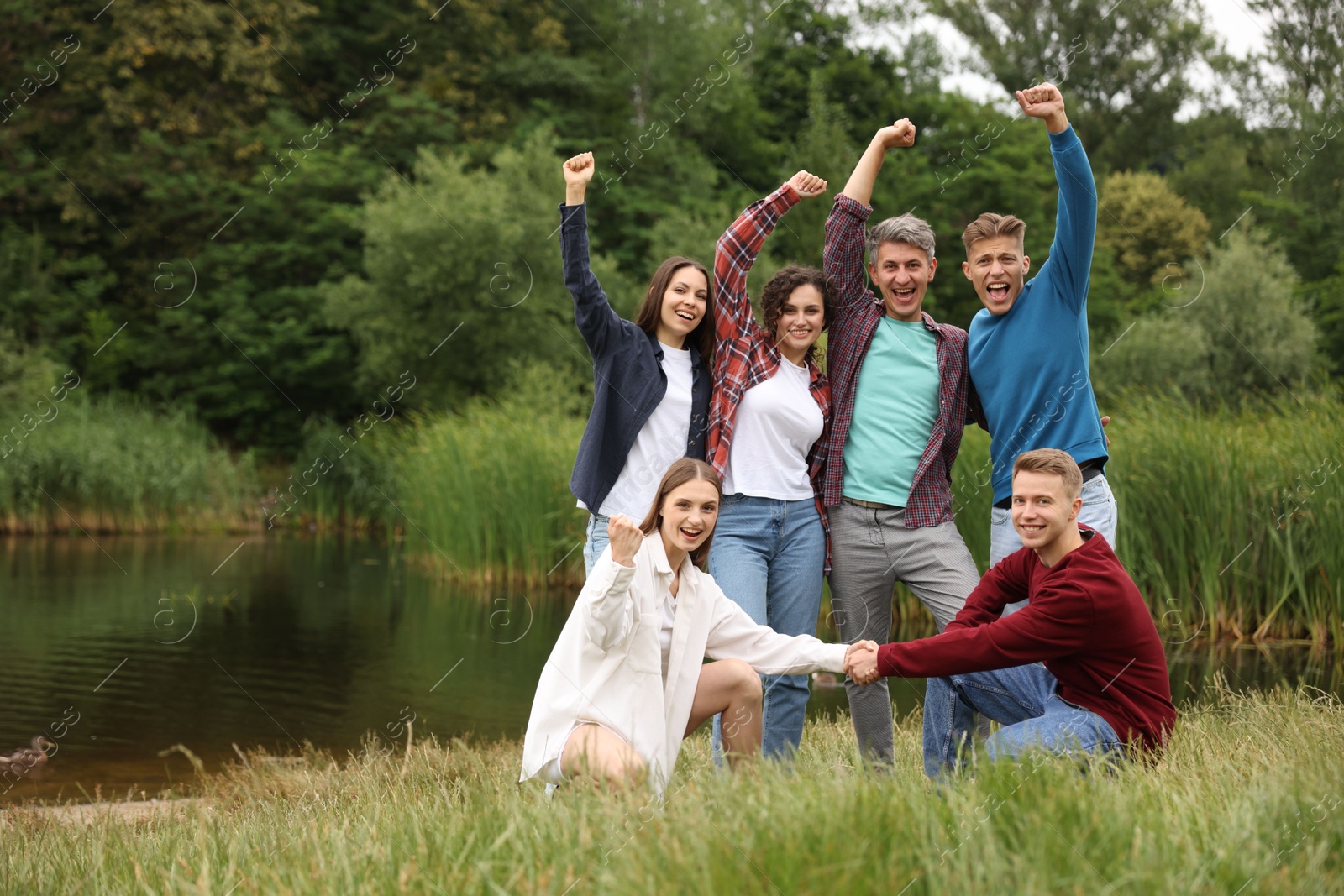 Photo of Team building. Group of happy people together outdoors