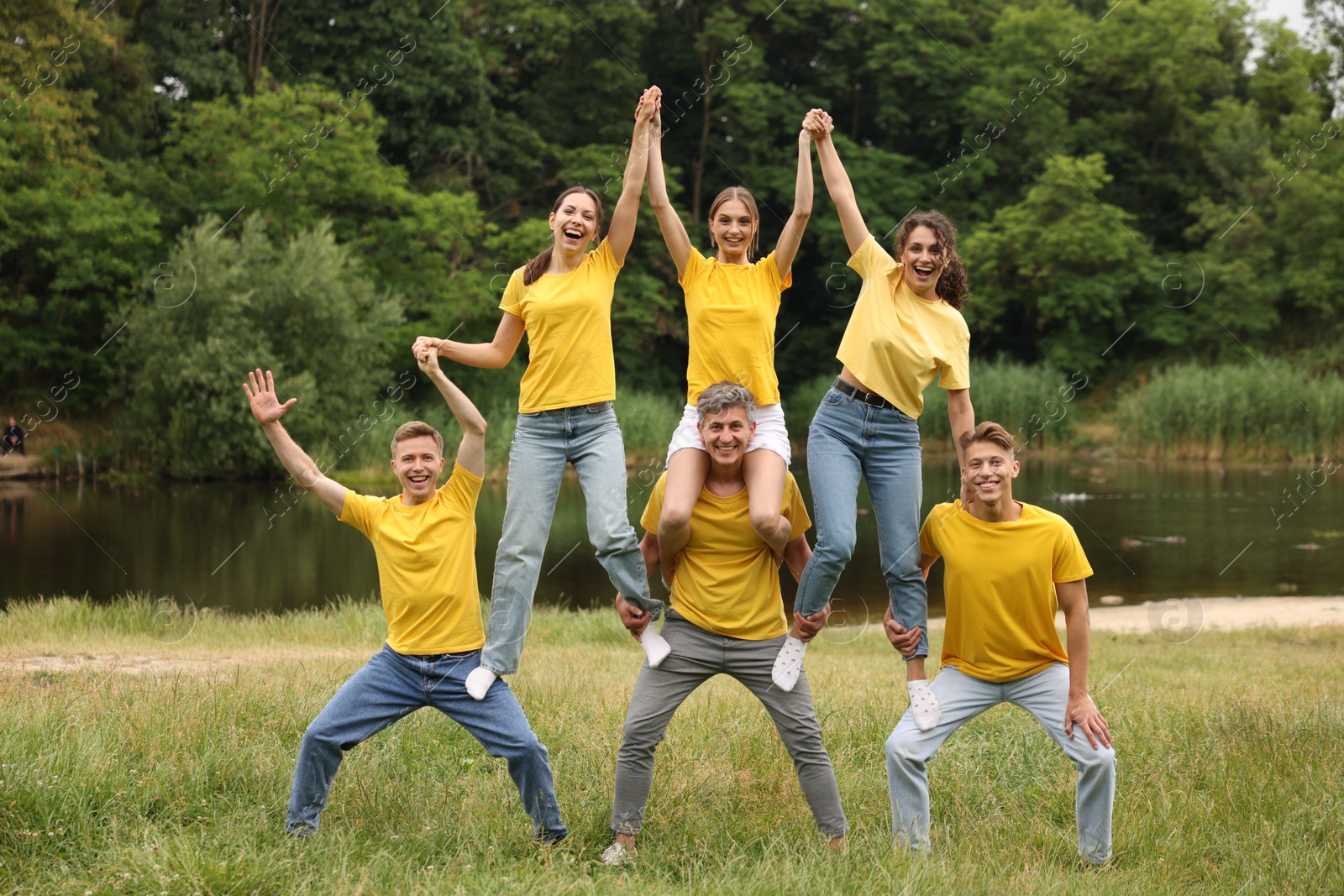 Team building. Group of happy people together outdoors Photo of Team building. Group of happy people together outdoors