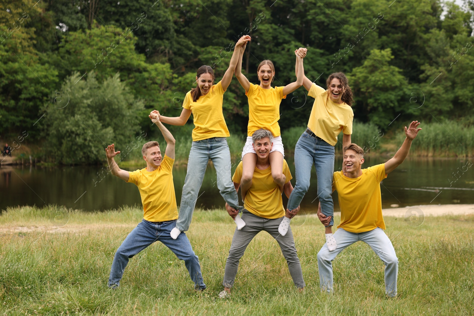 Photo of Team building. Group of happy people together outdoors