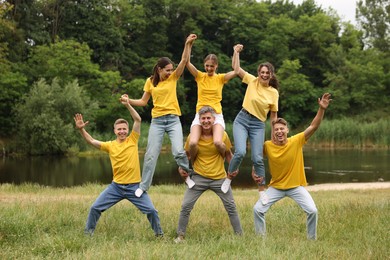 Photo of Team building. Group of happy people together outdoors