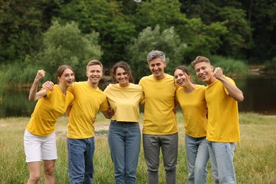 Photo of Team building. Group of happy people together outdoors