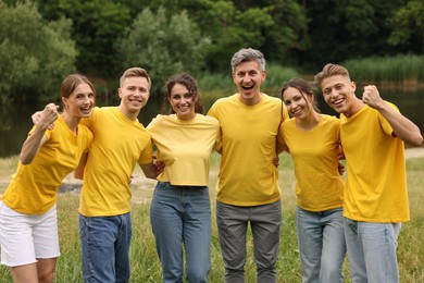Photo of Team building. Group of happy people together outdoors