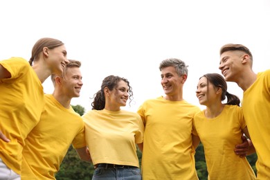 Photo of Team building. Group of happy people together outdoors