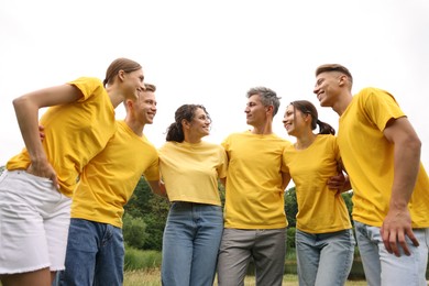 Photo of Team building. Group of happy people together outdoors