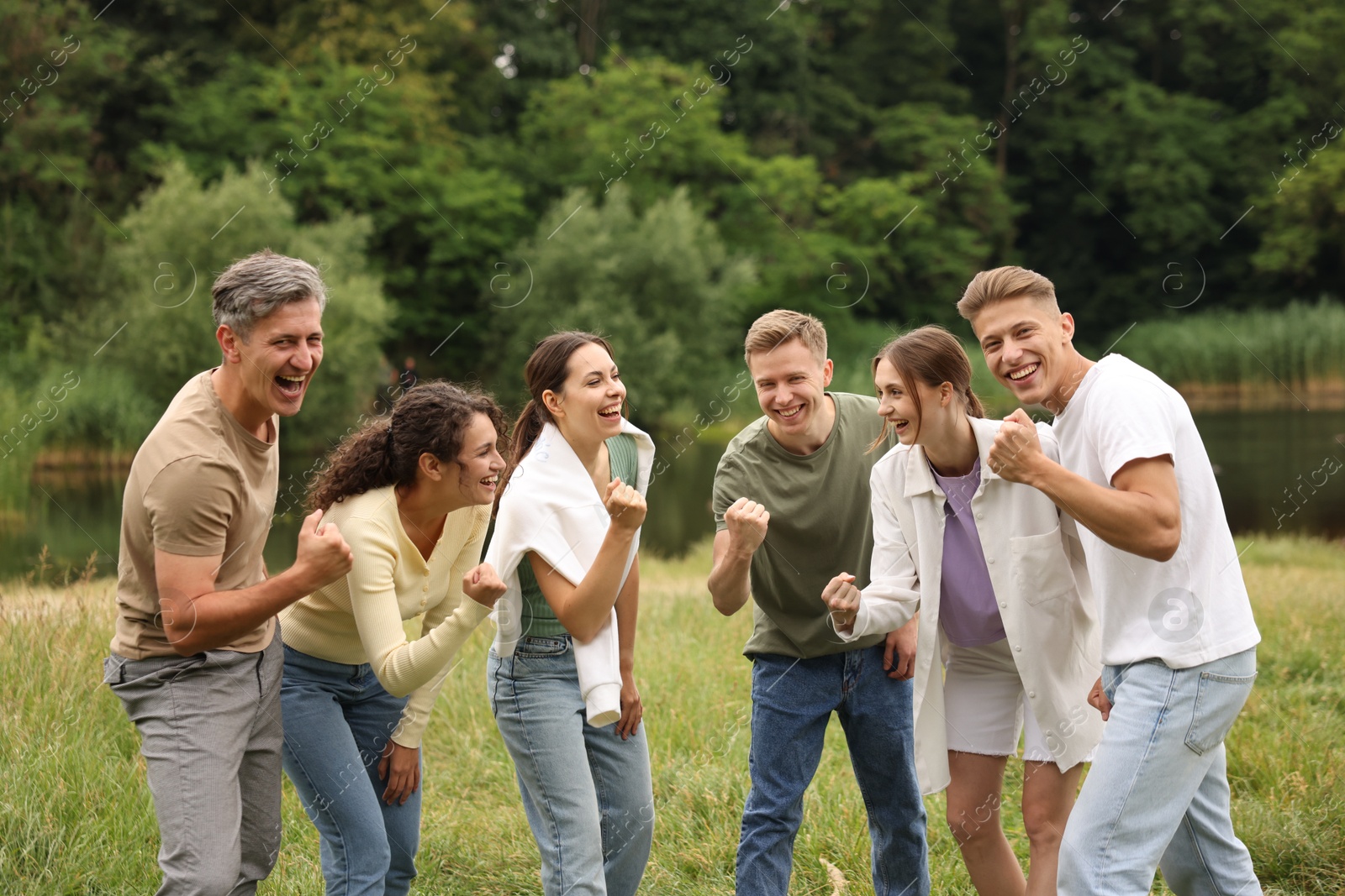 Team building. Group of happy people together outdoors Photo of Team building. Group of happy people together outdoors
