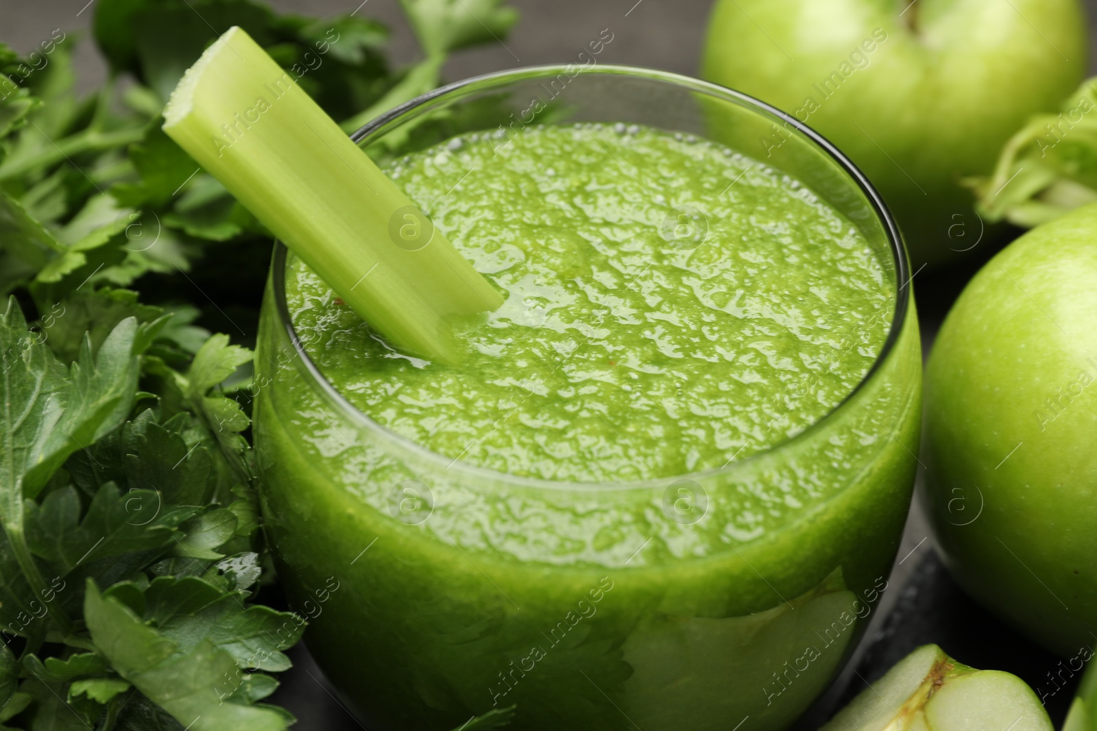 Superfood. Refreshing smoothie in glass and ingredients on dark table, closeup Photo of Superfood. Refreshing smoothie in glass and ingredients on dark table, closeup