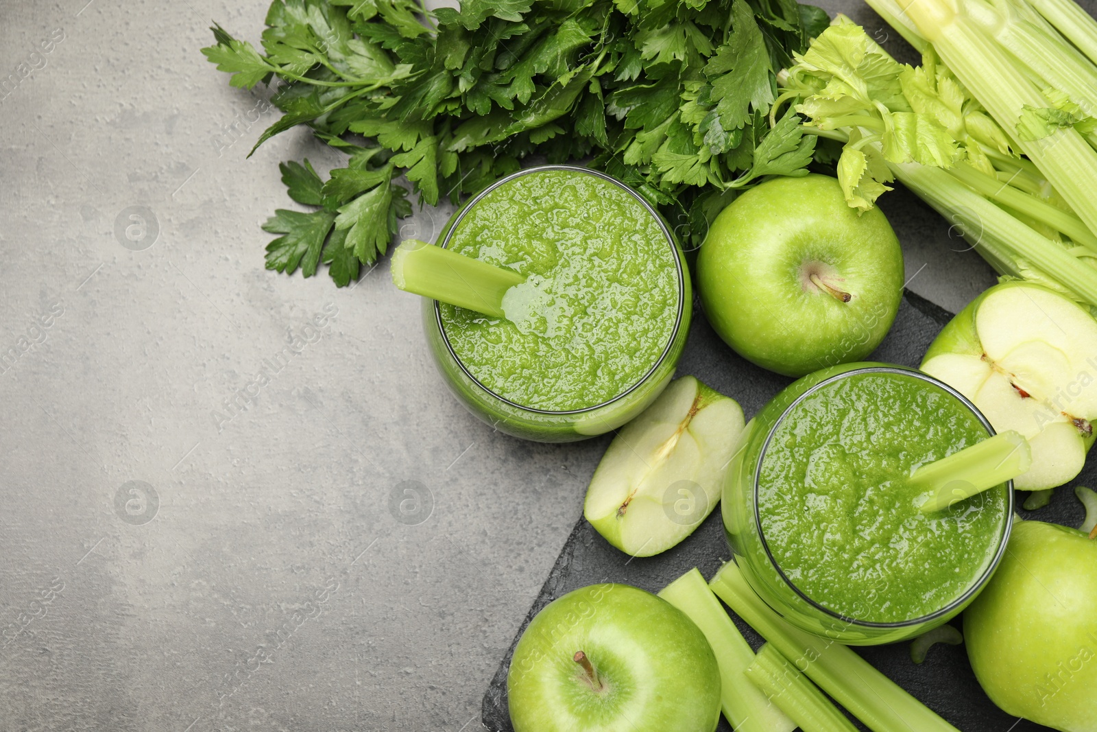 Superfood. Refreshing smoothie in glasses and ingredients on dark textured table, flat lay. Space for text Photo of Superfood. Refreshing smoothie in glasses and ingredients on dark textured table, flat lay. Space for text