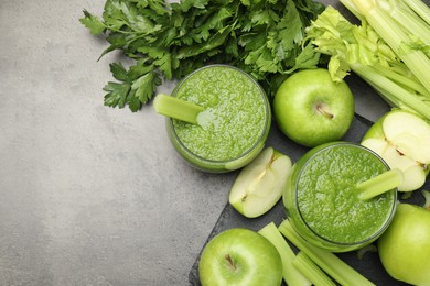 Photo of Superfood. Refreshing smoothie in glasses and ingredients on dark textured table, flat lay. Space for text
