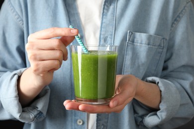 Photo of Superfood. Woman with glass of tasty smoothie, closeup