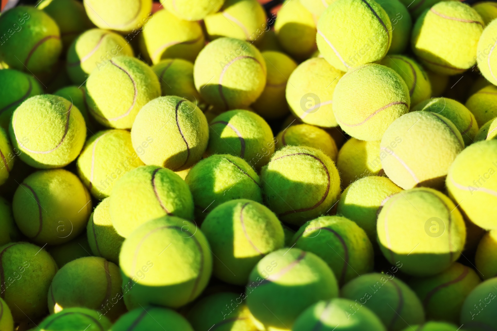 Many tennis balls in cart outdoors, closeup Photo of Many tennis balls in cart outdoors, closeup