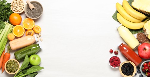 Photo of Superfood. Bottles with tasty smoothies and ingredients on light wooden table, flat lay. Space for text